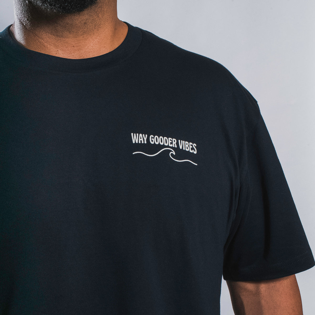 Front chest graphic on the navy Golden Horizon Tee