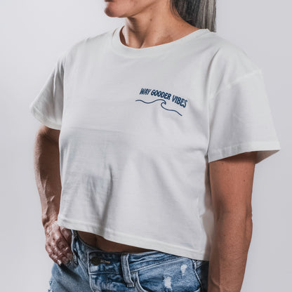 Woman wearing the natural Golden Horizon crop tee showing the cropped fit