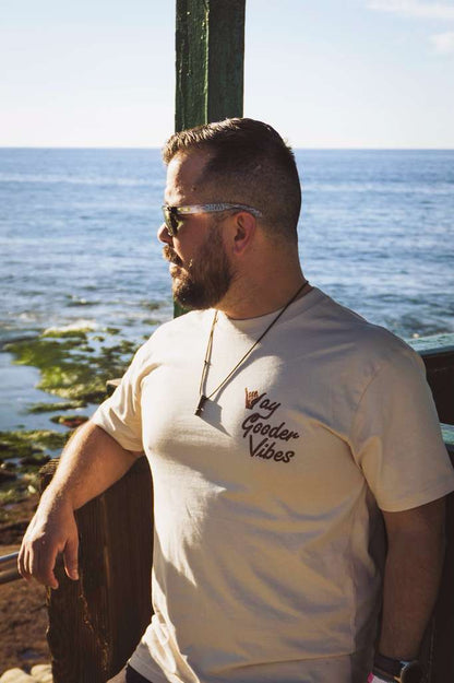 Man wearing the bone Gooder Vibes Tee, front lifestyle view